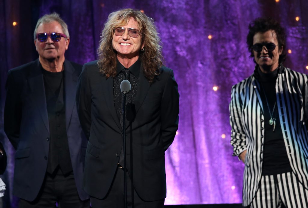 "NEW YORK, NEW YORK - APRIL 08:  (L-R) Ian Gillian, David Coverdale, and Glenn Hughes of Deep Purple speak onstage at the 31st Annual Rock And Roll Hall Of Fame Induction Ceremony at Barclays Center of Brooklyn on April 8, 2016 in New York City.  (Photo by Kevin Kane/WireImage for Rock and Roll Hall of Fame)"